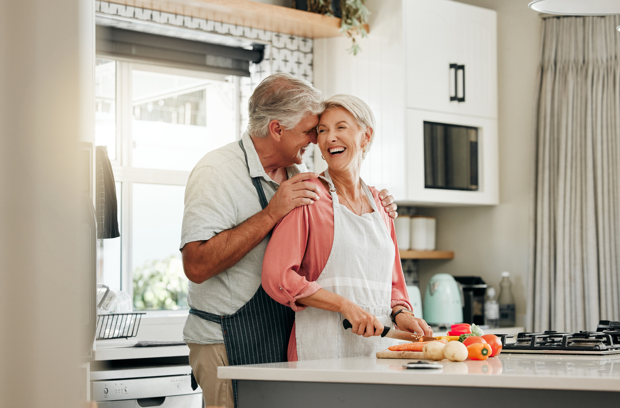 Happy couple enjoying their newly remodeled kitchen